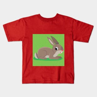 brown rabbit lies on a grassy meadow Kids T-Shirt